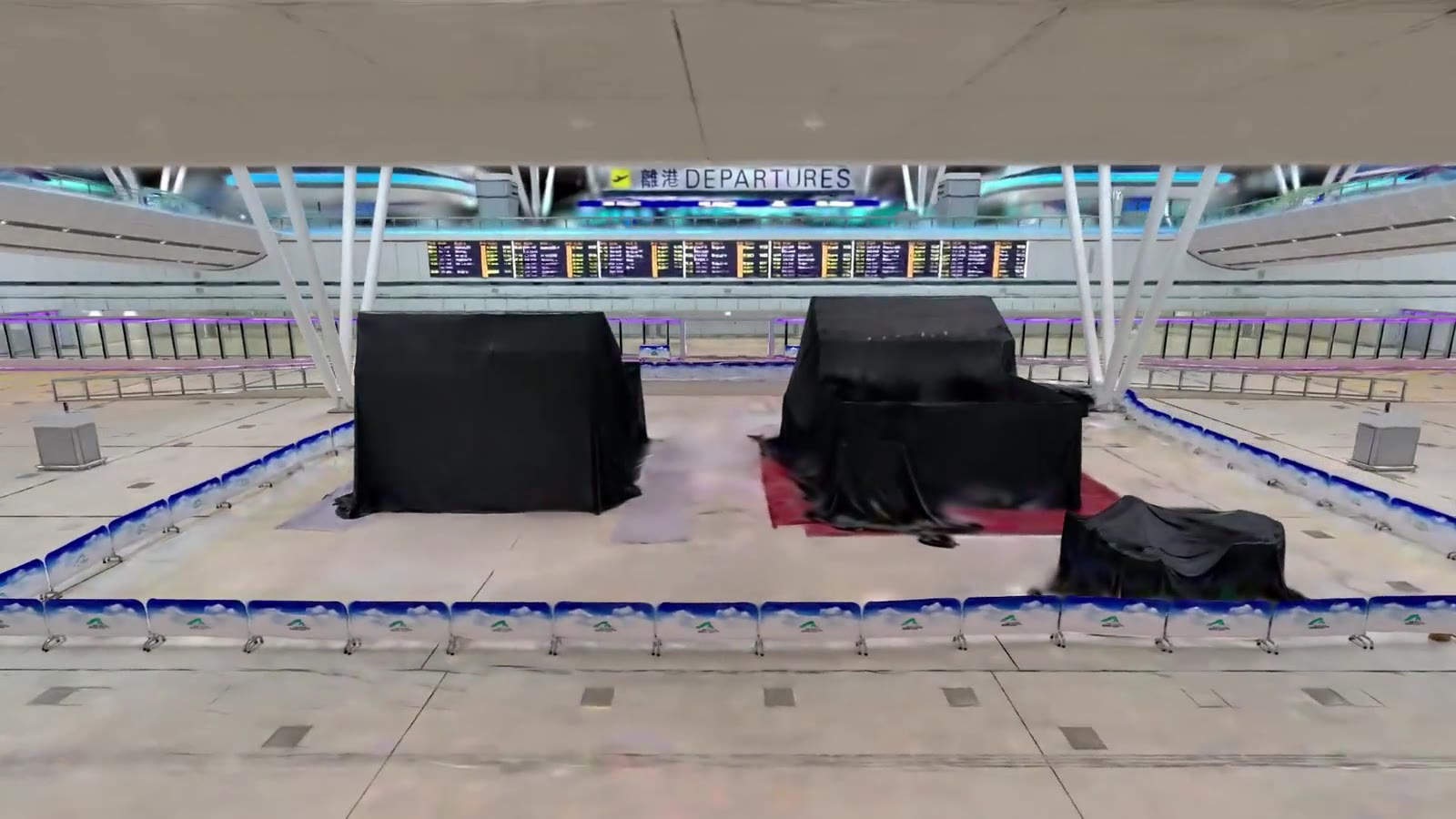 Before: covered hoarding in the HKIA departures hall